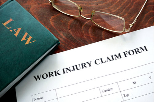 Law book and form to file workers' compensation in Florida