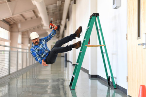 Construction worker falling off ladder. He needs a Miami workers' comp lawyer.