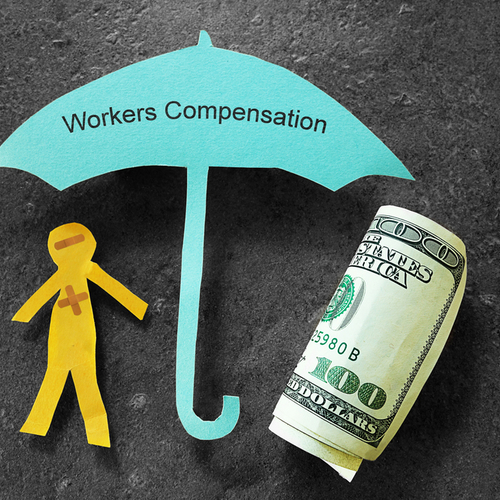 Paper figure under umbrella of workers' compensation insurance coverage.