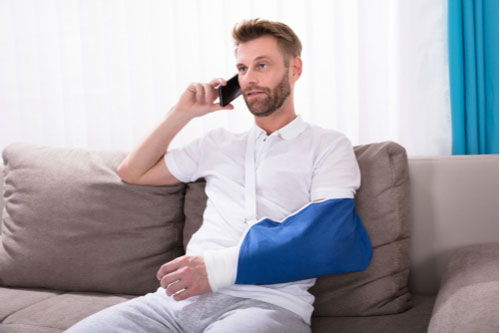 personal injury claim concept, man with hurt arm
