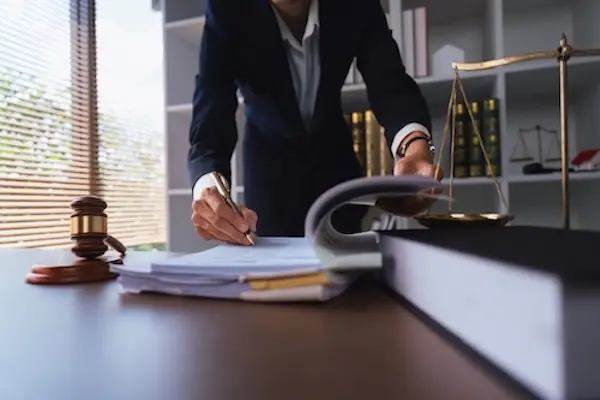 Miami workers compensation lawyer at Miami Lawyers 360 reviewing a workers compensation claim file and deadline calendar for an injured worker in Miami-Dade County Florida