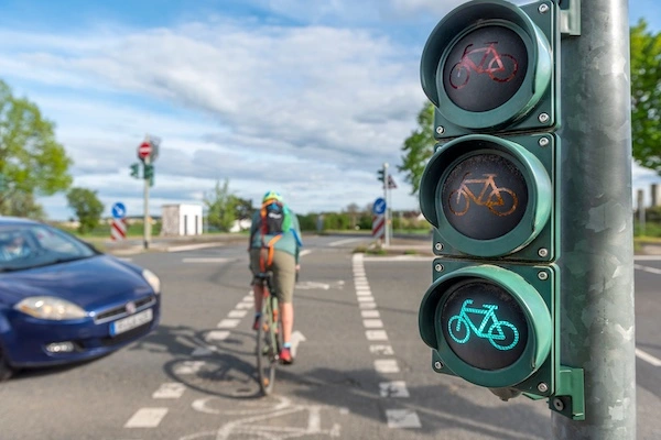 A cyclist about to be struck by a car represents video evidence for a bicycle accident lawyer to use in a client's case.