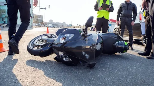 A motorcycle at the scene of an accident to represent a victim who may need a motorcycle accident lawyer to file a case.