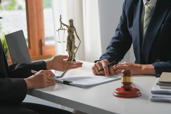 Pedestrian accident lawyer consulting with an injured client about a personal injury claim