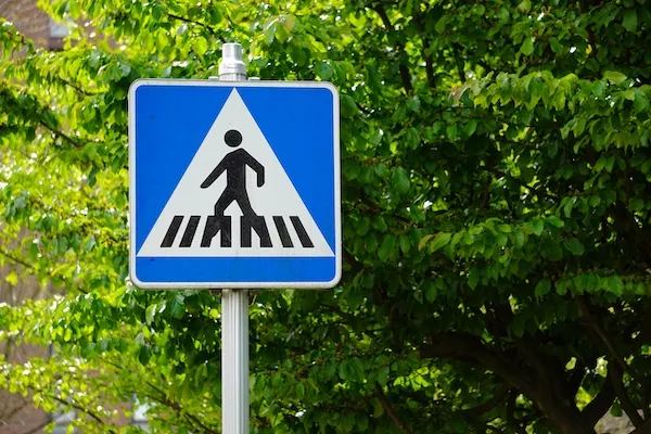 A pedestrian crossing sign represents a Miami pedestrian accident lawyer from Miami Lawyer 360.
